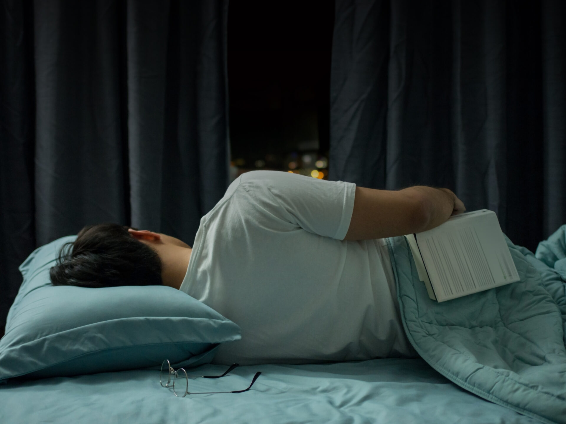 all asleep while reading book in bed at night